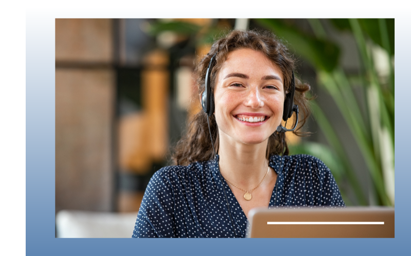 woman smiling with headset and laptop